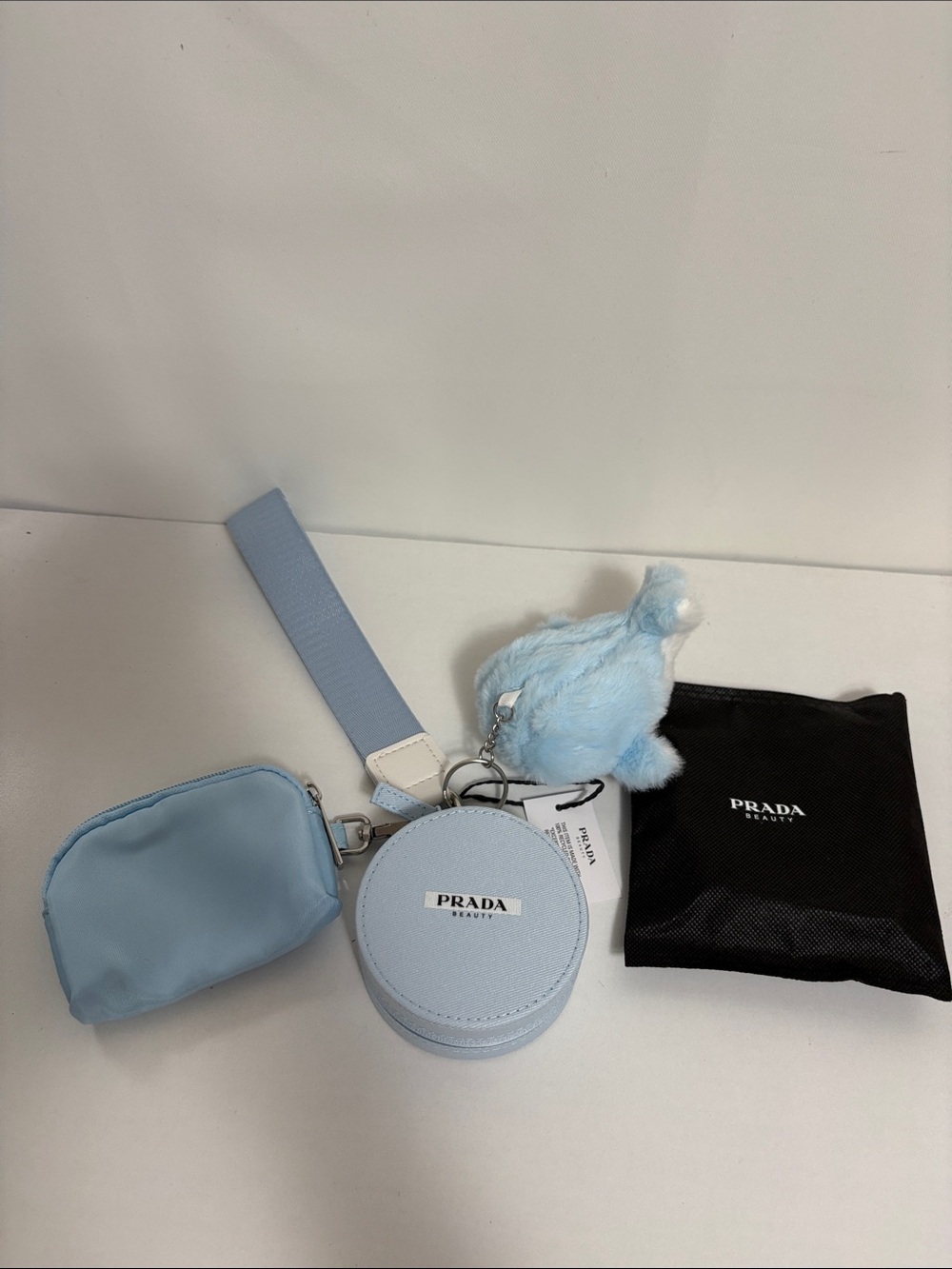 Prada Beauty Round Case with blue wristlet pouch and keychain - Picture 1 of 11
